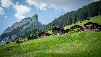 Typical wooden houses at Gimmelwald in the Swiss Alps of Switzerland - travel photography