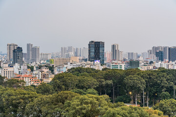 Obraz premium Aerial sunset view to Ho Chi Minh city - there a alot of skyscraper, cityscape in the evening, tree in the city. Travel concept
