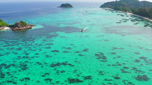 Aerial view of Sunrise beach with long tail boats in Koh Lipe, Satun, Thailand