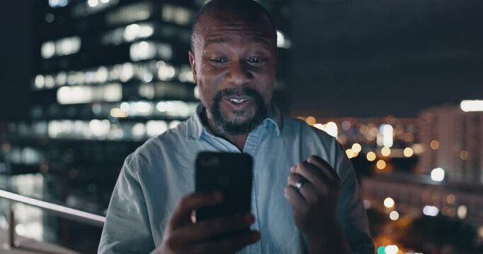 Success, celebration and black man with phone on city rooftop at night. Winner, wow and surprised businessman fist pump with 5g mobile smartphone in town celebrating win, good news or financial goals