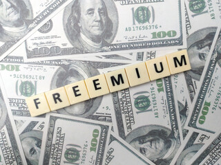 Toys word with the word FREEMIUM on a banknotes background.
