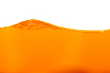 Close up bright orange juice texture for health and nature waves