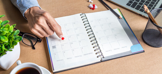 Businessman agenda calendar and reminder agenda work online at home men plan daily appointments and vacation travel journals in a diary at their desk . calendar reminder event concept .	
