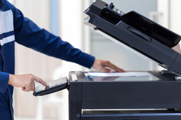 Businessman press button on panel of printer photocopier  network , Working on photocopies in the office concept , printer is office worker tool equipment for scanning and copy paper.