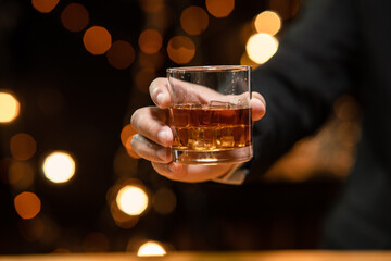 Barman pouring whiskey whiskey glass beautiful night