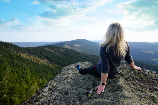 Woman on the top of mountain Klein Osser in the National park Bayerischer Wald, Germany.