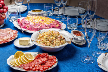 Fototapeta na wymiar Russian salad on a Christmas food table.