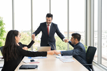 Businessman discussing of his work to corporate colleagues in meeting in the office. Group of business man and woman discussing business strategy plan together with partnership