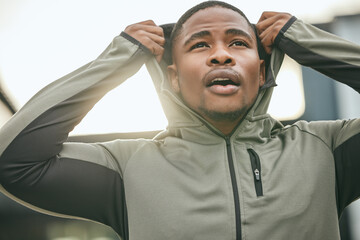 Fitness, vision and hoodie with a sports black man getting ready for a workout, exercise or...