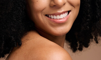 Face beauty, dental and teeth of black woman in studio isolated on a brown background. Skincare,...