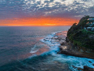 Aerial sunrise seacape with clouds and colour