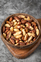 Brazil nut on dark background. Brazil nut in bowl. Studio shoot. close up