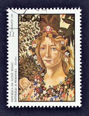 Cancelled postage stamp printed by Guinea Bissau, that shows painting "Awakening of Spring", Sandro Botticelli (detail), circa 1985.