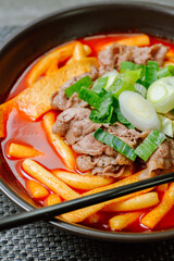 Tteokbokki, Stir-fried Rice Cake : Sliced rice cake bar (garaetteok) or thin rice cake sticks (Tteokbokkitteok) stir-fried in a spicy gochujang sauce with vegetables and fish cakes.