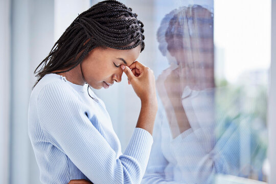 Mental Health, Window And Black Woman With Depression, Thinking And Stress In Home. African American Female, Girl And Headache For Financial Crisis, Burnout And Anxiety For Problems, Glass And Sad