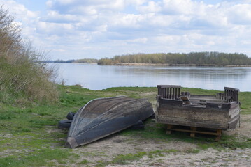 Wooden rowing boat lying on the bank of the Vistula River,  Czerwinsk over Vistula, Mazovia, Poland