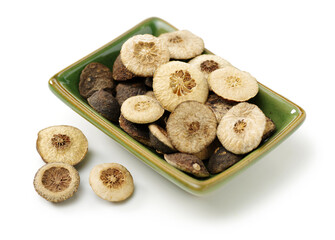 Dried bitter orange used in chinese herbal medicine isolated over white background. Zhi Ke, Fructus citri Aurantii. White background