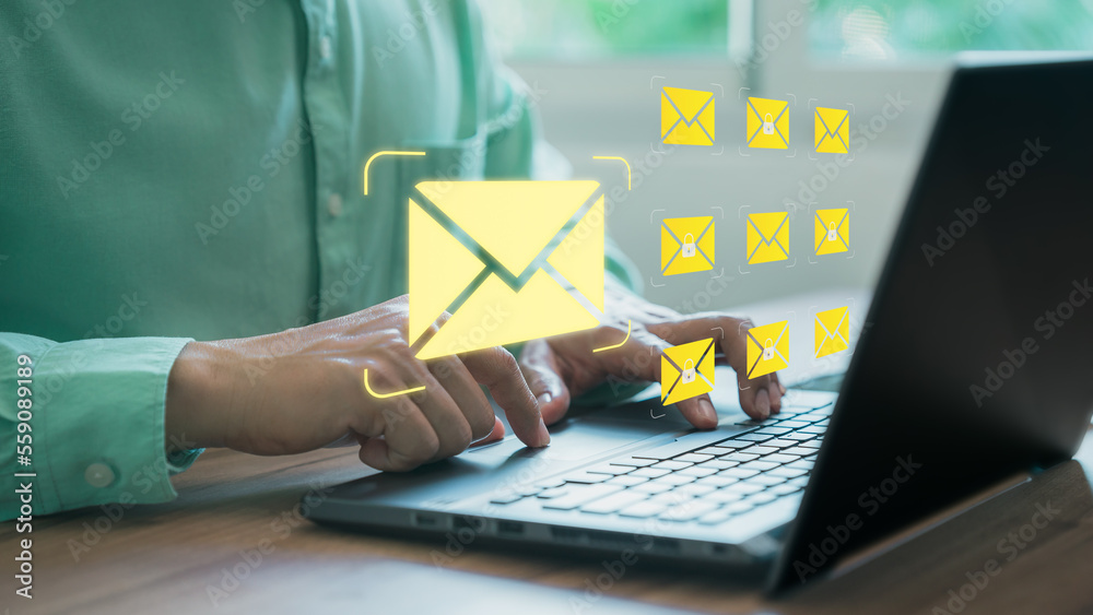 Aufkleber Freelancer's hand using computer laptop and sending online message with email icon, email marketing concept, send email or newsletter, internet network working online.