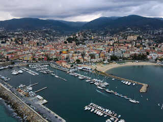 Aerial view of Sanremo, Italian city on the seashore in Liguria, north Italy. Drone flying along...