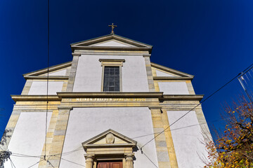 Entrance of white catholic church at the old town of Olten, Canton Solothurn, in bright sunlight on a sunny autumn day. Photo taken November 10th, 2022, Olten, Switzerland.