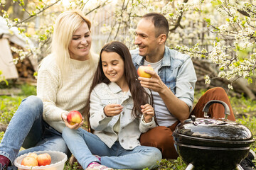 Family having a barbecue in their garden