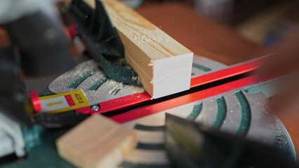 cutting wood with a miter saw. construction tool at work