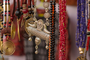 Beautiful Bengali traditional jewelery, works of handicraft, for sale during Handicraft Fair in Kolkata. Selective focus.