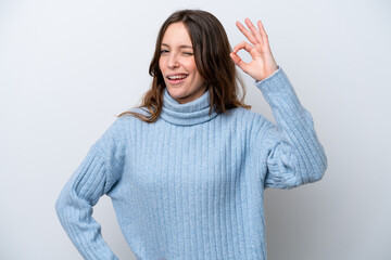 Young caucasian woman isolated on white background showing ok sign with fingers