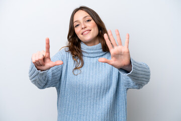 Young caucasian woman isolated on white background counting seven with fingers