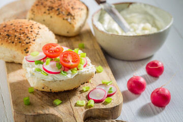 Homemade sandwich with crunchy bread, radish and fromage cheese.