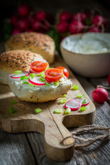 Fresh and tasty sandwich with radish, tomatoes and creamy cheese.