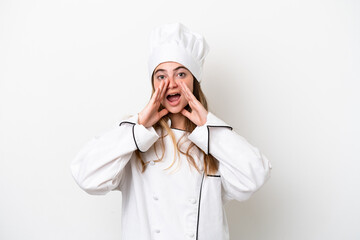 Young caucasian chef woman isolated on white background shouting and announcing something