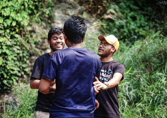 group of friends gossiping in park, south asian young boys enjoying the beauty of nature 