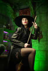 sexy girl in a witch costume in hats for Halloween