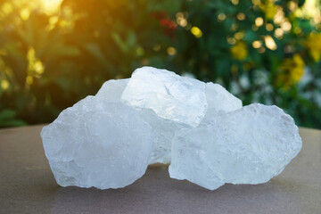 Crystal clear alum stones or Potassium alum on nature background.  Useful for beauty and spa...
