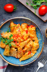 Homemade Cabbage rolls with meat, rice and vegetables also known as sarma, golubtsy, dolma on Rustic Background