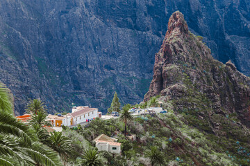A Feature Rock in Masca Valley with Tourists in the Distance