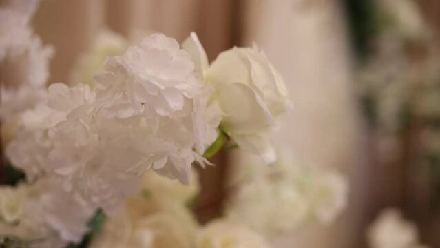 decoration of flowers on the wedding table at the celebration in the restaurant