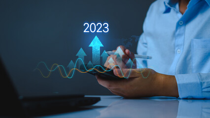 Growth and development chart of company in new year 2023. Planning, long term investment, opportunity, challenge and business strategy in new year 2023. Development to success and motivation.