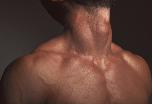 Man, body or neck muscles on dark studio background and exercise aesthetic, workout goals or intense training progress. Zoom, skin or bodybuilder fitness model with blood veins or healthcare wellness