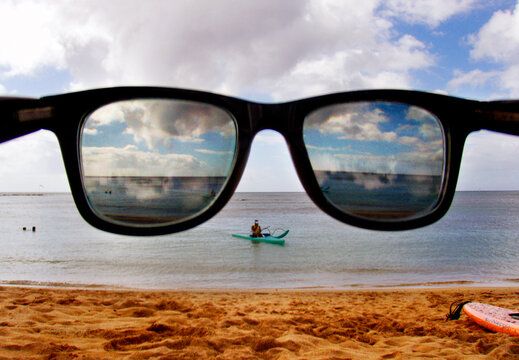 Sunglasses and the ocean in Hawaii.