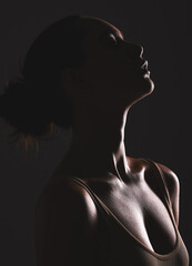 Woman beauty silhouette, face and dark, sexy with cosmetics and seductive fantasy with mysterious aesthetic. Female profile with skin, sexy woman facial and shadow against black studio background.