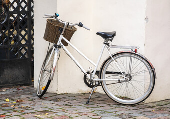Fototapeta na wymiar White women's bicycle on the street.