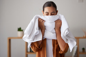 Laundry, fresh and woman smelling a towel after cleaning, housework and washing clothes in the...