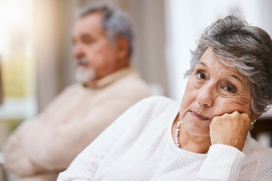 Senior couple, stress and depressed together on home living room couch thinking about divorce, retirement and financial problem or crisis. Old man and woman with conflict in marriage after fight