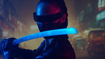 Cyberpunk ninja girl in a mask and with a katana. Beautiful female samurai woman on the background of Asian city downtown. © Acronym