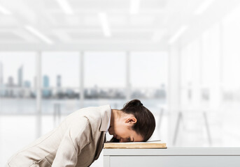 Exhausted business woman face down sleeping