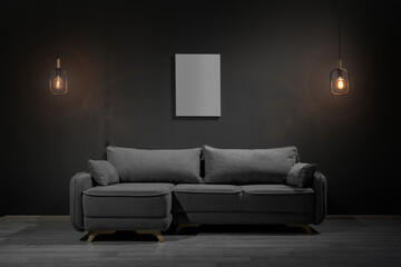 Gray corner sofa with lamps and blank picture, loft style
