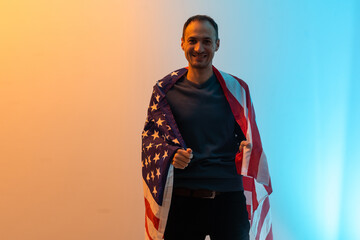 man is holding american USA flag.