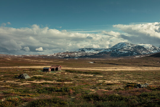Cabin in mountain landscape at Knutshoe in Jotunheimen National Park in Norway
